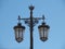 Typical street lamp in Lisbon in front of blue sky