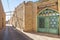 Typical street of the old town of Yazd, iran, with its typical clay walls, ancient gates and clay buildings.