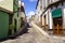 Typical streets of a small Canarian town with white houses and bright colors. Arucas Gran Canaria