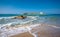 Typical summer image of an amazing pictorial view of a sandy beach and an old white church in a small isl