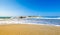 Typical summer image of an amazing pictorial view of a sandy beach and an old white church in a small isl