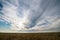 Typical summer landscape, sown field and sunset sky