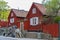 Typical swedish wooden residential house painted in traditional falun red on the skippers alley Skeppargrand in a historic