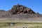 Typical Tibetan place of power and worship, marked with colorful flags with mantras near lake Seling