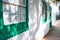 Typical tiny Canarian house with cactus garden and green doors or windows on the island of Lanzarote, Teguise, Canary Islands,