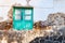 Typical tiny Canarian house with cactus garden and green doors or windows on the island of Lanzarote, Teguise, Canary Islands,