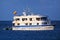 Typical tourist yacht anchored at Suarez Point at Espanola Island, Galapagos National park, Ecuador