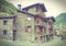 Typical traditional dark brick Andorra rural houses - postcard l
