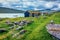 Typical turf-top houses on the coast of Sorvagsvatn lake, Vagar island. Wonderful morning view of Faroe Islands, Denmark, Europe.