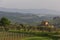 Typical Tuscan farmhouse with vineyard and olive trees