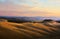 Typical Tuscany landscape; sunset over rolling hills and Tuscany