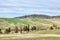 Typical Tuscany landscape in Val d`Orcia. In the background the medieval village of Pienza