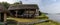 Typical Viking Long House with a reconstructed boat on the banks of the River Slaney in the Irish National Heritage Park