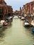 Typical Water Canal with Boats in Murano Isle near Venice, Italy