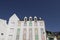 Typical white hotel building with lovely multicolored shutters in Quiberon, closed hotel out of season