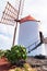 Typical White Windmill in Jardin Cactus garden, Guatiza village, Lanzarote, Canary islands, Spain