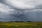 Typical wild landscape in Brittany with amazing dark cloudy sky, unique desolate countryside with nobody