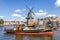 Typical windmill and medieval architecture in the port, Haarlem, The Netherlands