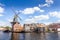 Typical windmill and medieval architecture in the port. The windmill, known as De, Haarlem, The Netherlands