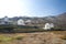 Typical windmill in Santorini. White buildings on a hill, a windmill and trees, is typical for Santorini, Greece. Famous Windmills