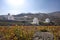 Typical windmill in Santorini. White buildings on a hill, a windmill and trees, is typical for Santorini, Greece. Famous Windmills