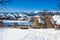 Typical winter scenic view with haystacks and sheeps