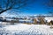 Typical winter scenic view with haystacks and sheeps