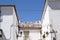 Typically Mediterranean, whitewashed residential buildings and terra cotta roof tiles in Altea, Alicante Spain