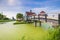 Typically traditional Dutch house, windmill, historical architecture and bridge over water at the Zaanse Schans