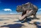 Tyrannosaurus rex is drinking water on desert with copy space