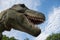 Tyrannosaurus rex realistic model. Head close of dinosaur with open mouth