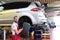 Tyre change on the car in a workshop by a mechanic