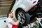 Tyre change on the car in a workshop by a mechanic