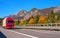 TYROL, AUSTRIA - October 14, 2017: Red truck on a high-speed mountain road.