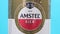 Tyumen, Russia-December 10, 2020: Amstel premium pilsener beer can logo of non-alcoholic beer close-up. selective focus