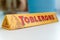 Tyumen, Russia-November 13, 2021: Toblerone logo close up. Swiss milk chocolate on a white background. Made by Kraft