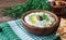 Tzatziki sauce in wooden bowl