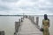 U Bein Bridge, Myanmar-Aug 02th, 2015: Myanmar was walking on U Bein Bridge with his bicycle.