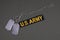 U.S. Army Branch Tape with dog tags on olive green uniform