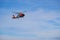 A U.S. Coast Guard helicopter performing a medical evacuation for a cruise ship passenger