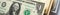 U.S. money banknotes of 1, 10 and 100 dollars. Banner or headline about the American dollar or economy. Public finance and