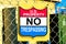 U.S. Property No Trespassing sign on fence