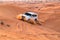 UAE, Fujairah 2017.19.11 Off-road safari on jeeps SUVs in the Arab orange-red sands desert in the sunset sun