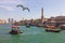 UAE: Tourist boats abra on canal Dubai Creek and old town