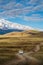 UAZ off-road minibus rides along a field road in the Kurai steppe