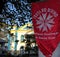 Ubatuba, SP, Brazil - 11 July 2022: Red flag with the symbol of the Holy Spirit festival in front of main church