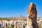 Uchisar castle on rock in ancient town on horizon, Cappadocia, T