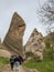 Uchisar, Turkey - April 15 - 2019: A group of tourists goes along the path in the national park Goreme