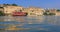 Udaipur City Palace on lake Pichola with tourist boat. Udaipur, Rajasthan, India