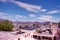 Udaipur, India : One of the lake surrounded by hills and Indian houses against blue sky